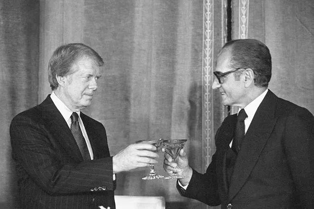 President Jimmy Carter meeting with Shah Reza Pahlavi of Iran, black & white